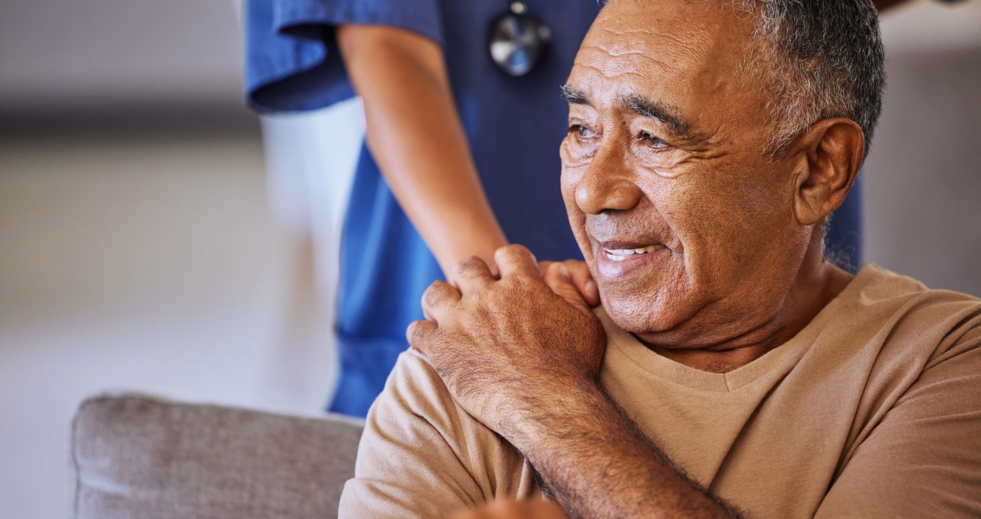 Old man holding the hand patting him on the shoulder